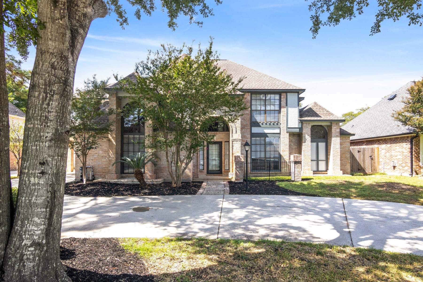 6039 Spring Creek Lane Spring, TX 77379 - Photo 3 of 48 a front view of a house with a yard