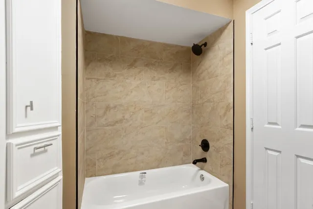 a bathroom with a white bath tub