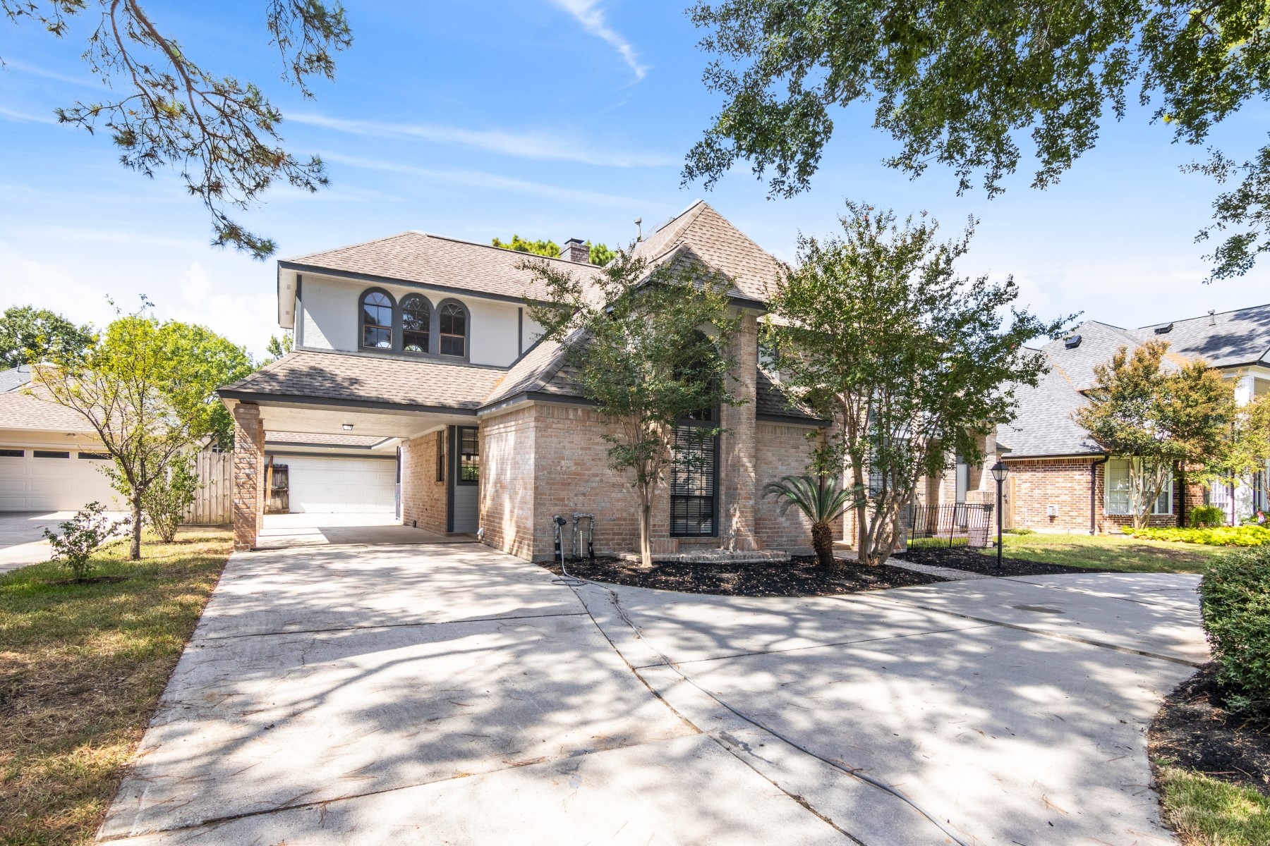 6039 Spring Creek Lane Spring, TX 77379 - Photo 4 of 48 a front view of a house with a yard
