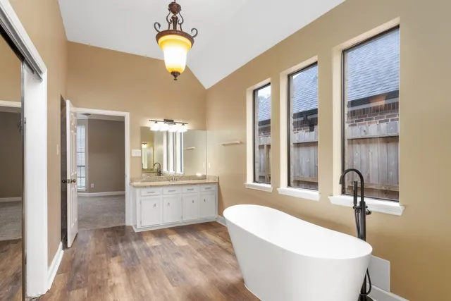 a bathroom with a bathtub and a sink
