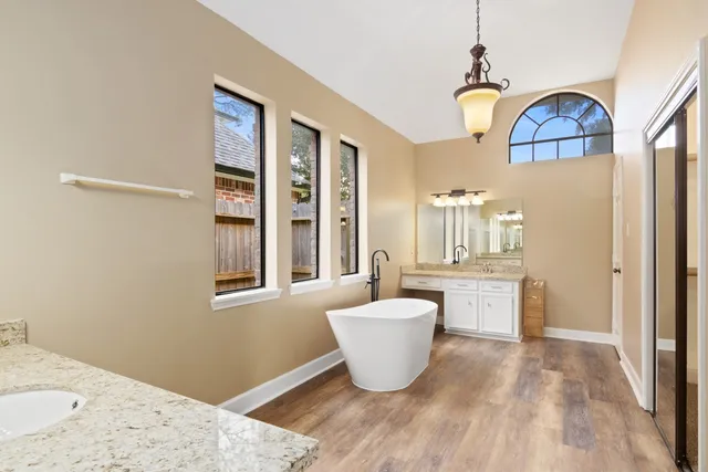 a view of a room with window and wooden floor