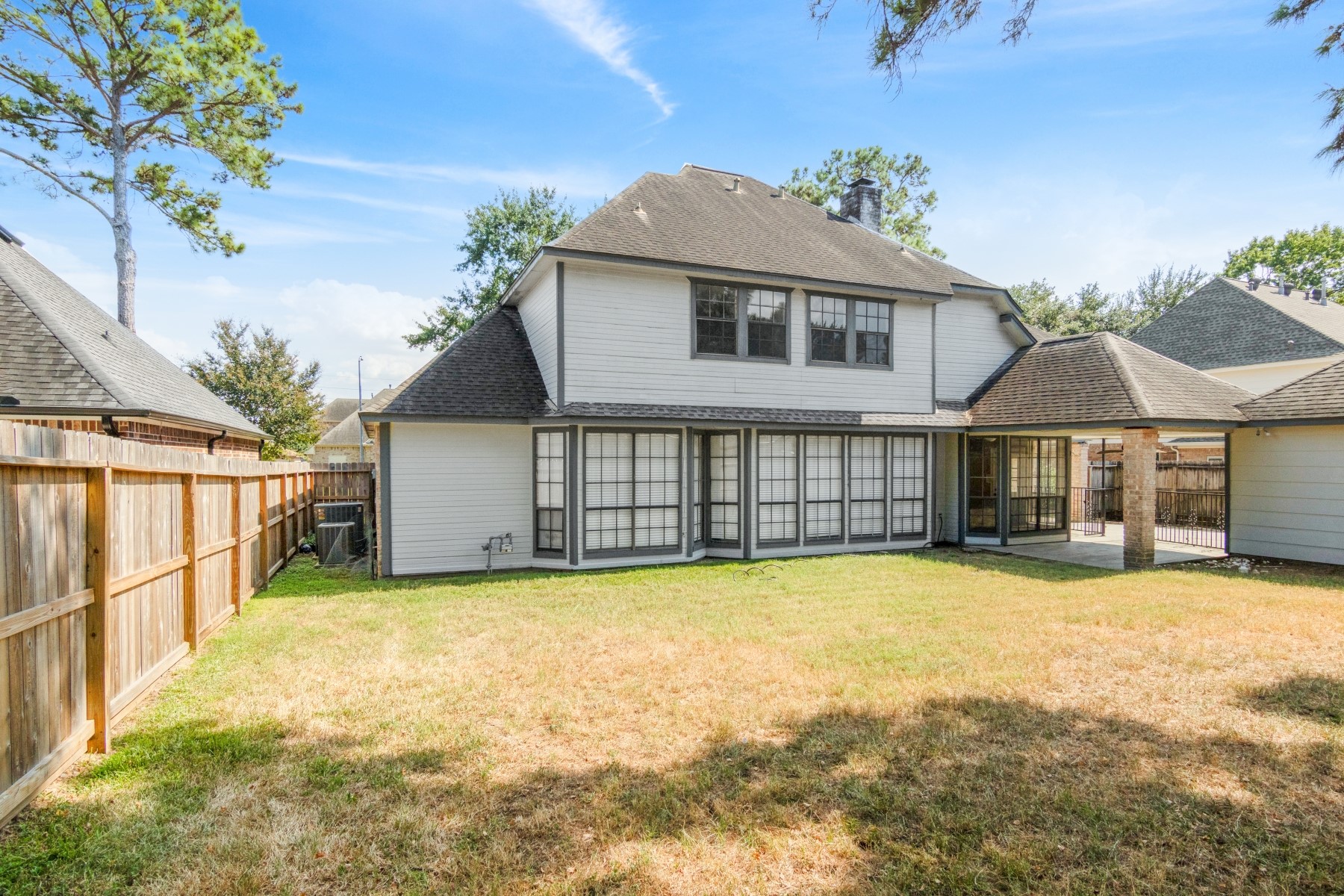 6039 Spring Creek Lane Spring, TX 77379 - Photo 48 of 48 a view of a house with a yard and sitting area