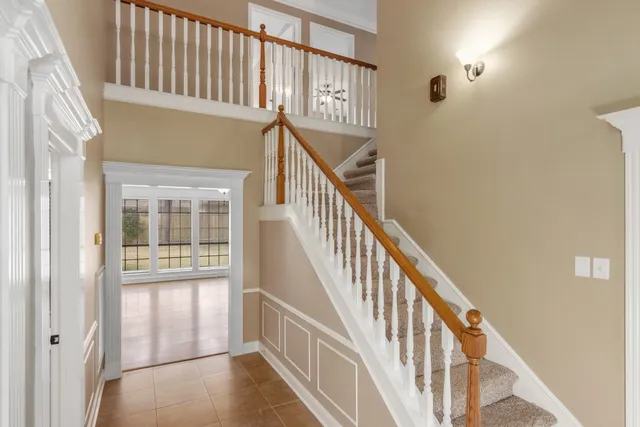 a view of staircase with lots of wooden floor and windows
