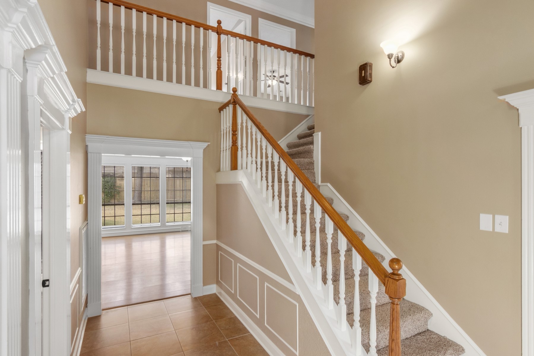 6039 Spring Creek Lane Spring, TX 77379 - Photo 8 of 48 a view of staircase with lots of wooden floor and windows