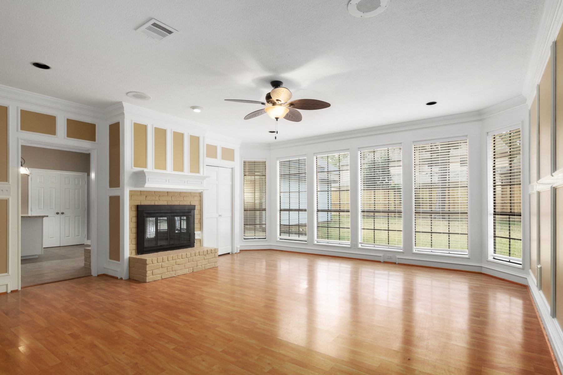 6039 Spring Creek Lane Spring, TX 77379 - Photo 10 of 48 a view of an empty room with a fireplace and a large window