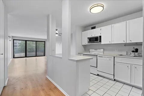 a kitchen with appliances cabinets and a sink