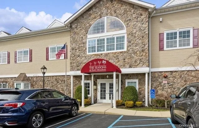 a view of a car parked front of a building