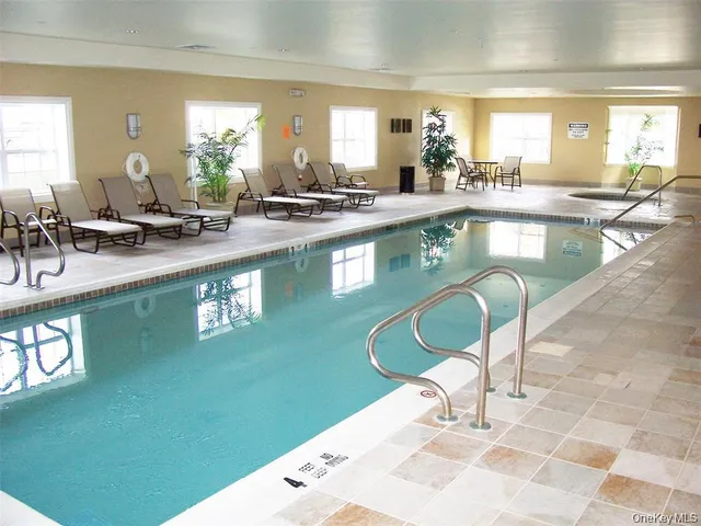 a kitchen with counter top space a sink and appliances