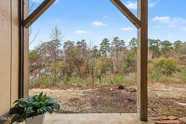 a bathroom with a granite countertop sink mirror and toilet