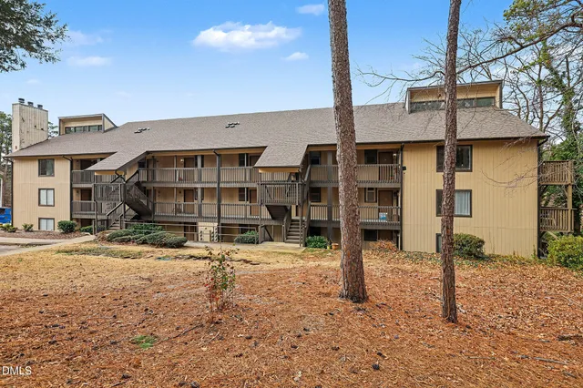 a picture of a bench in front of a wall