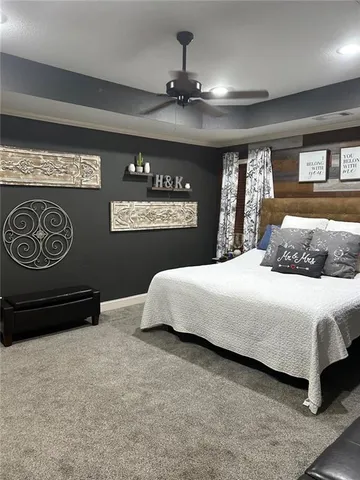 a bedroom with a bed and glass walk in closet