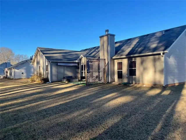a view of a house with a street