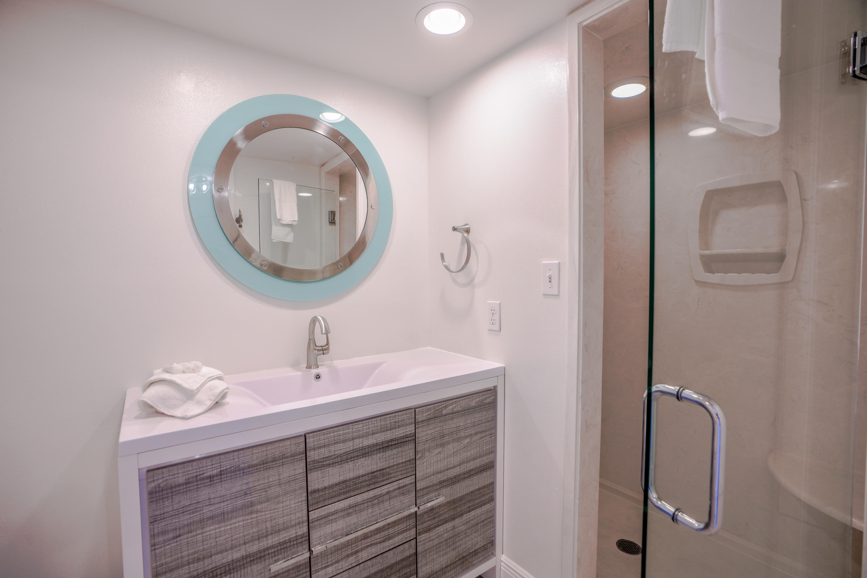 214 Blue Mountain Road, Unit 112 Santa Rosa Beach, FL 32459 - Photo 14 of 19 a bathroom with a sink and a mirror