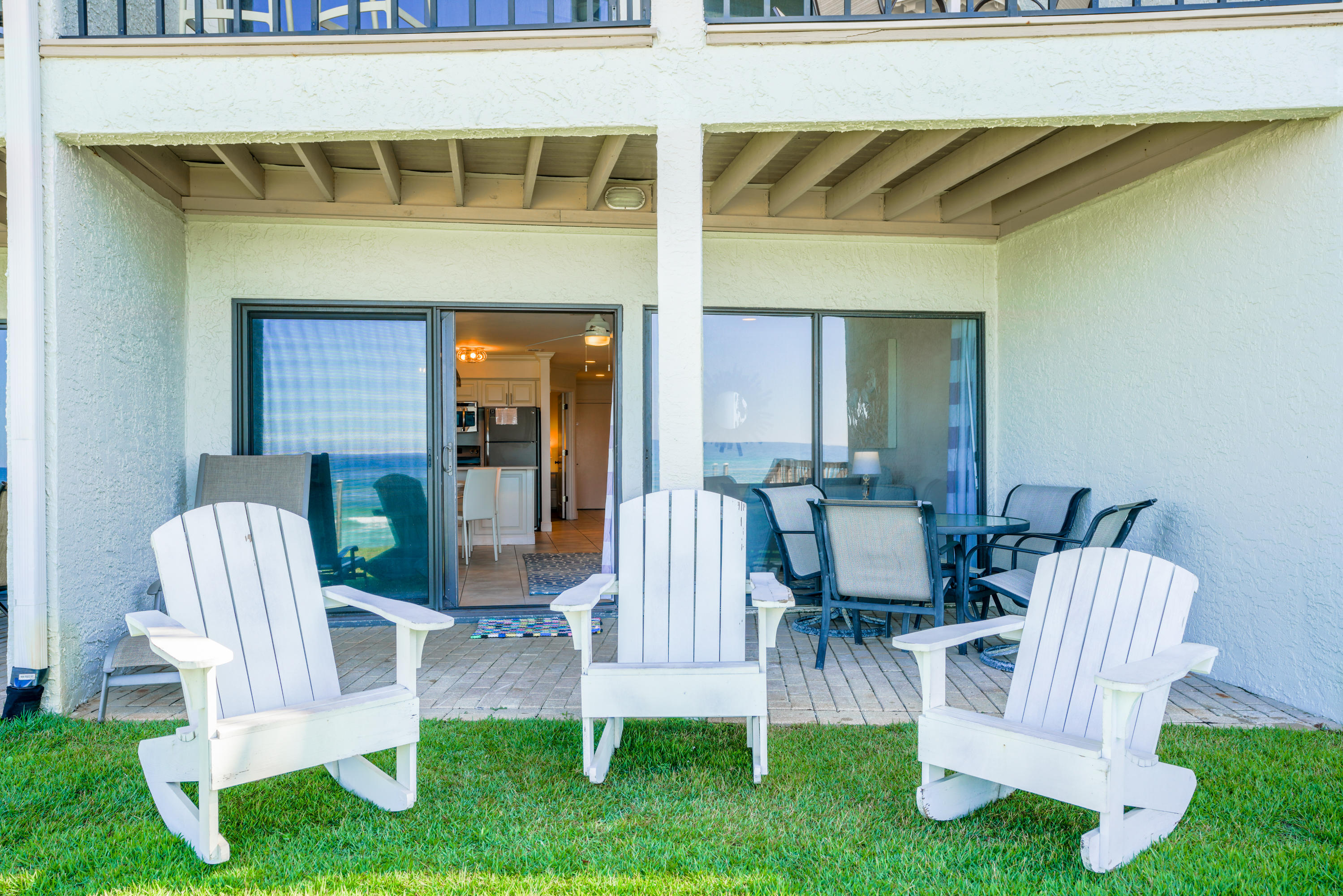 214 Blue Mountain Road, Unit 112 Santa Rosa Beach, FL 32459 - Photo 17 of 19 a view of two chairs in the patio