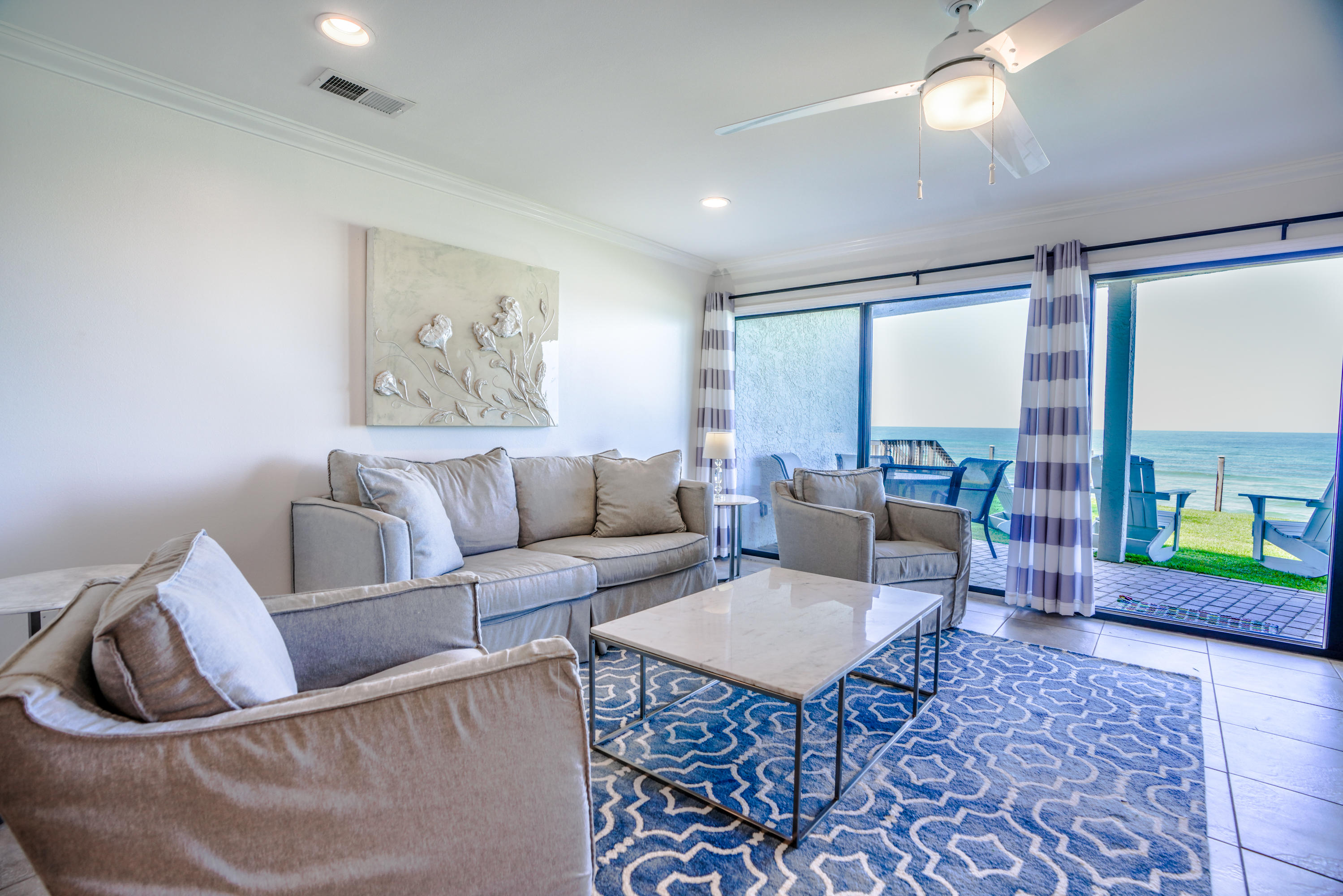 214 Blue Mountain Road, Unit 112 Santa Rosa Beach, FL 32459 - Photo 5 of 19 a living room with furniture and a large window