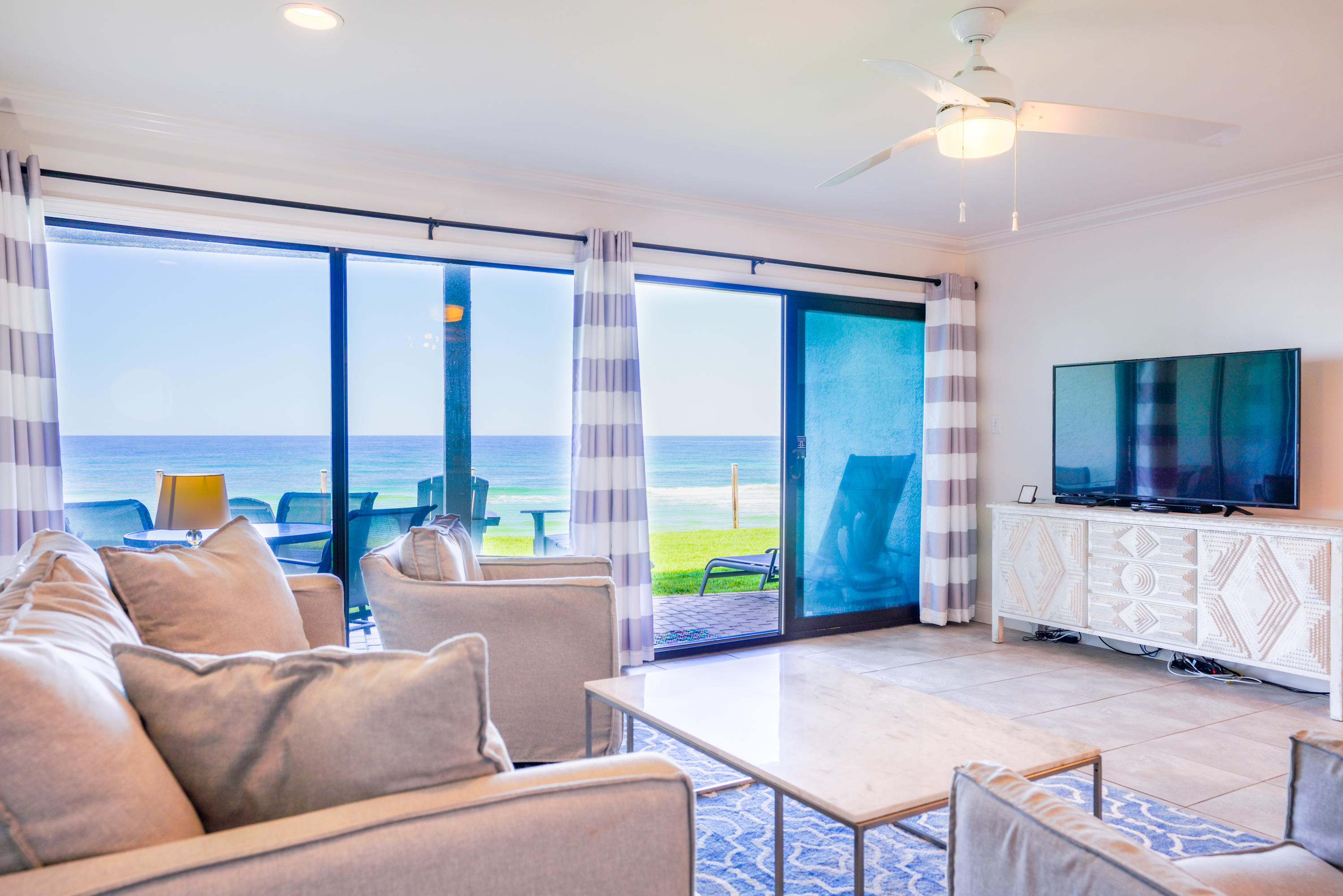 214 Blue Mountain Road, Unit 112 Santa Rosa Beach, FL 32459 - Photo 6 of 19 a living room with furniture and a large window