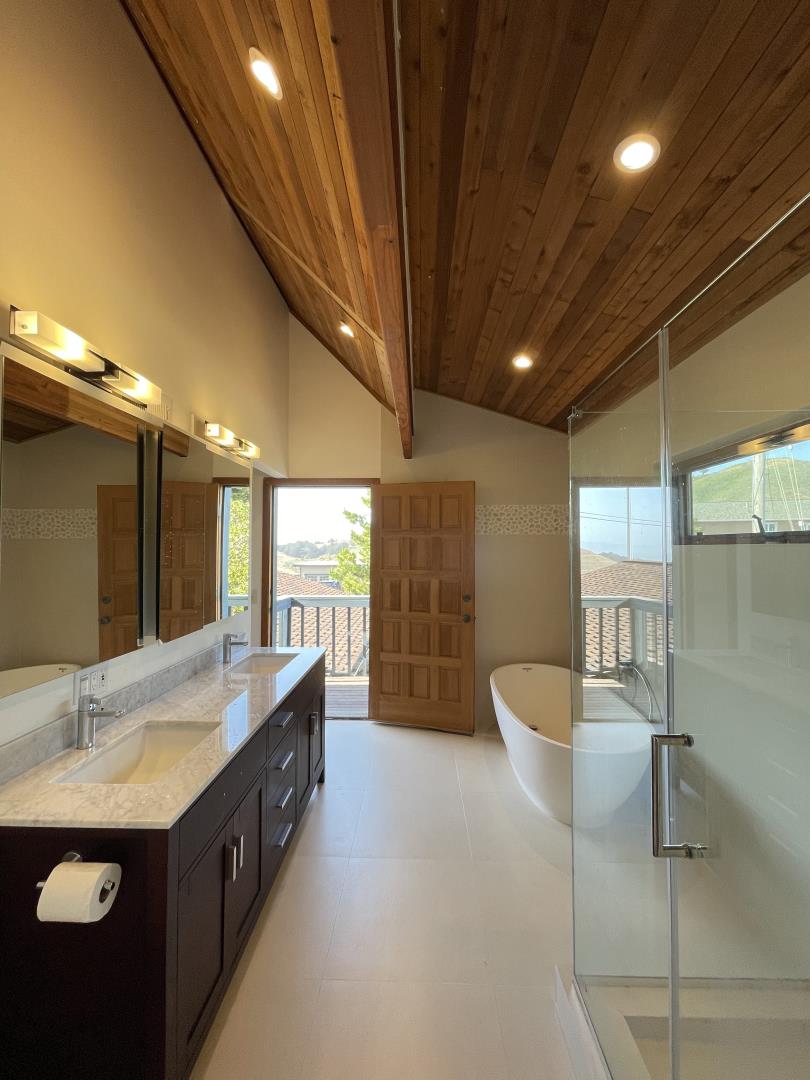 490 Talbot Avenue Pacifica, CA 94044 - Photo 17 of 33 a spacious bathroom with a double vanity sink and a large mirror