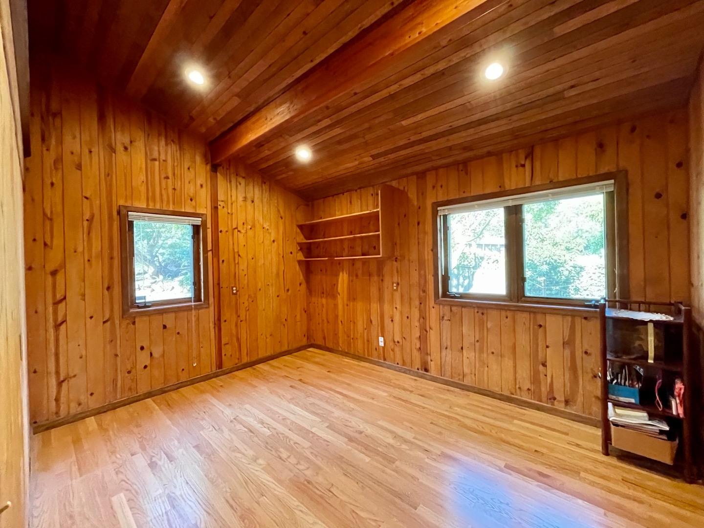 490 Talbot Avenue Pacifica, CA 94044 - Photo 21 of 33 an empty room with wooden floor and windows