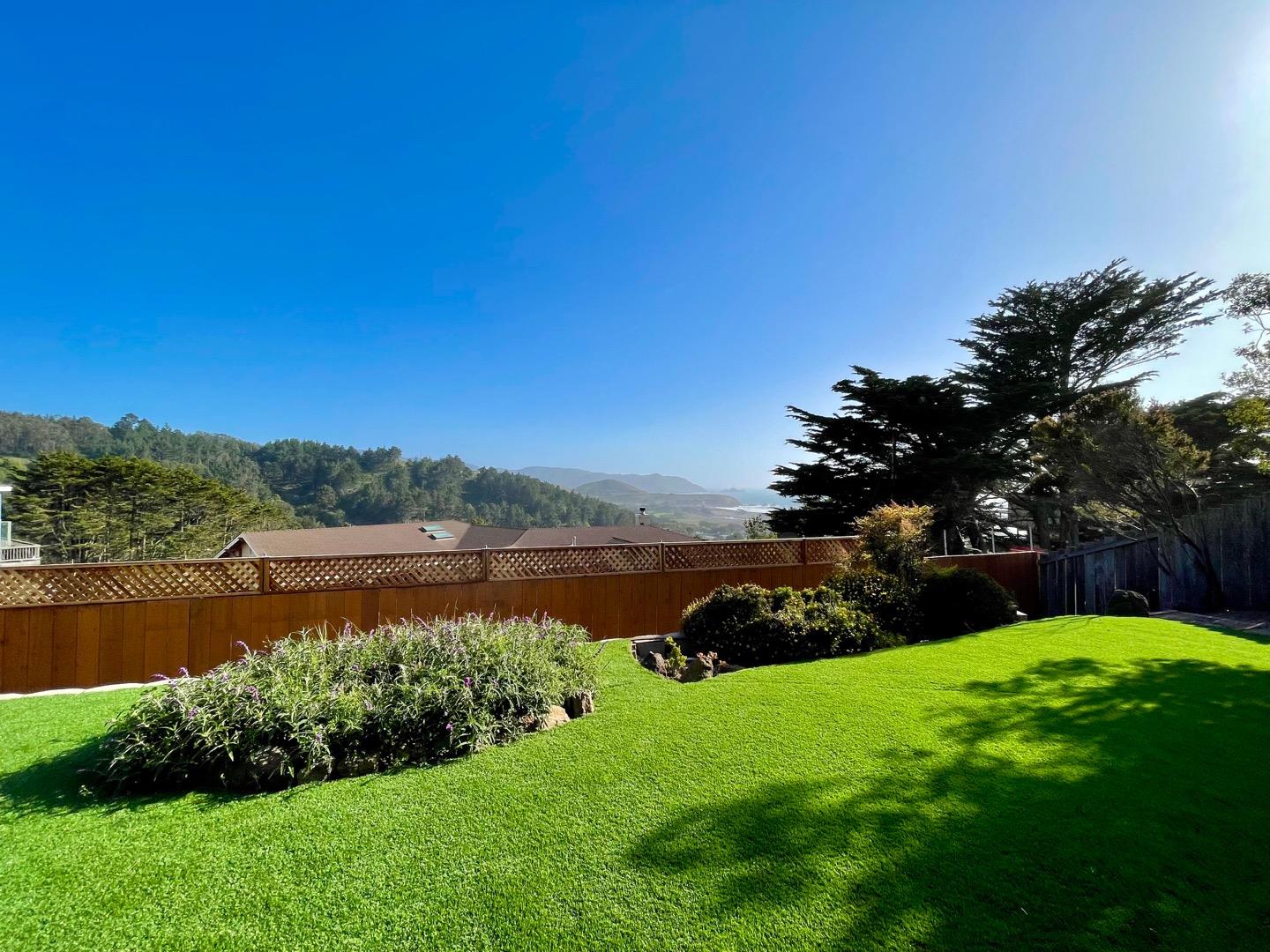 490 Talbot Avenue Pacifica, CA 94044 - Photo 32 of 33 a view of a lake with a house in the background