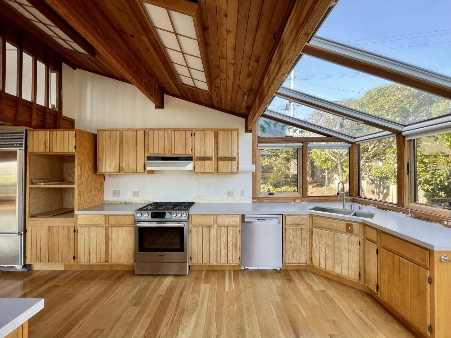 490 Talbot Avenue Pacifica, CA 94044 - Photo 6 of 33 a kitchen with stainless steel appliances granite countertop a stove a sink and a refrigerator
