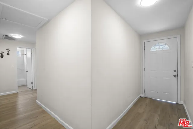 a view of small space with wooden floor