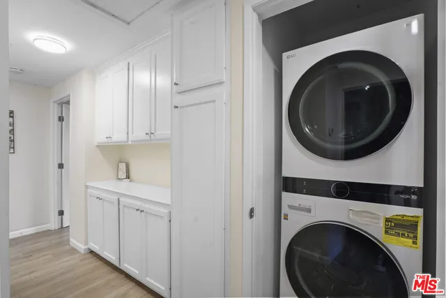 a view of a hallway with washer and dryer