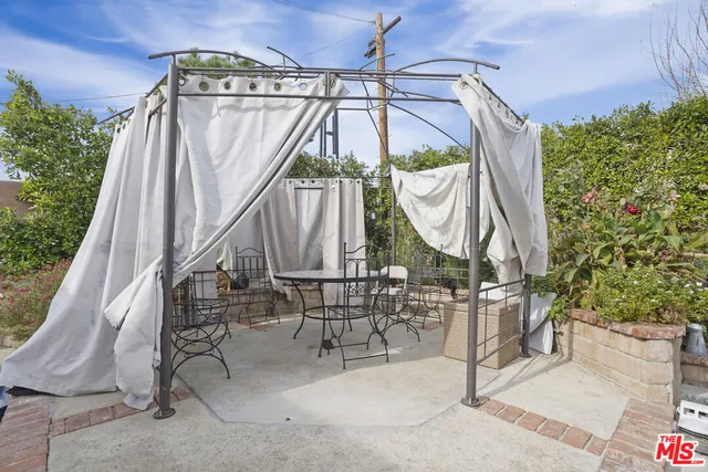 a view of a small yard with table and chairs
