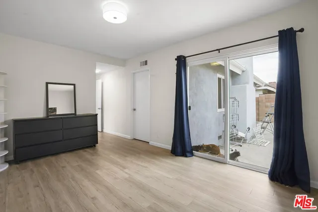 a room with window and a mirror