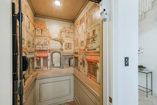 a kitchen with a sink a center island cabinets and a window