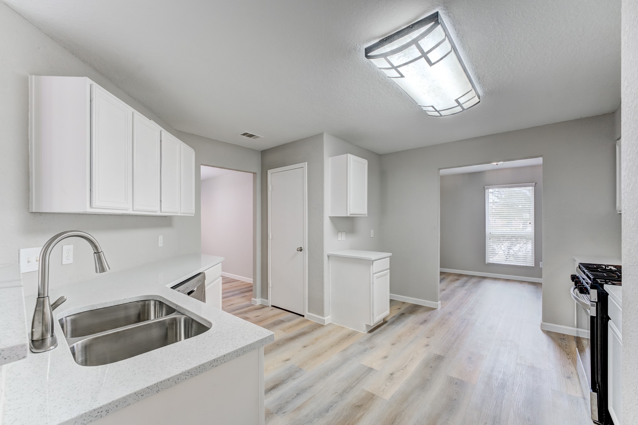 8038 Narrow Brook Way Houston, TX 77016 - Photo 12 of 50 a kitchen with sink and cabinets