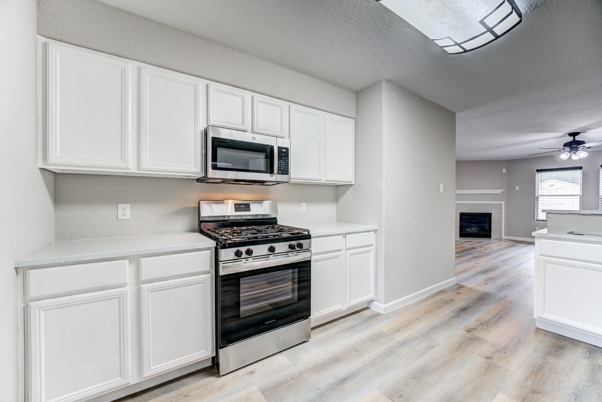 8038 Narrow Brook Way Houston, TX 77016 - Photo 15 of 50 a kitchen with granite countertop white cabinets and stainless steel appliances