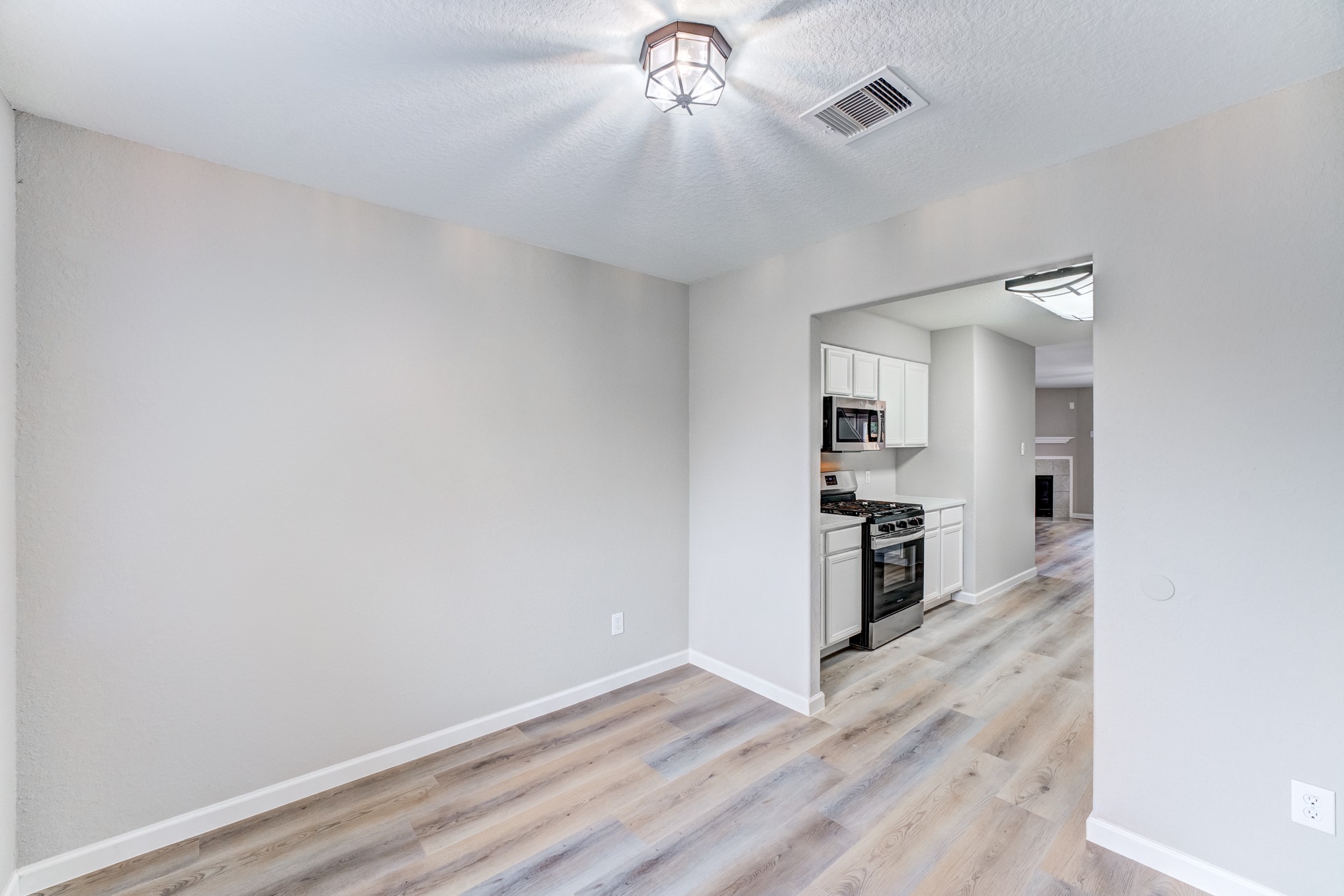 8038 Narrow Brook Way Houston, TX 77016 - Photo 18 of 50 a view of a kitchen with a sink and a stove top oven