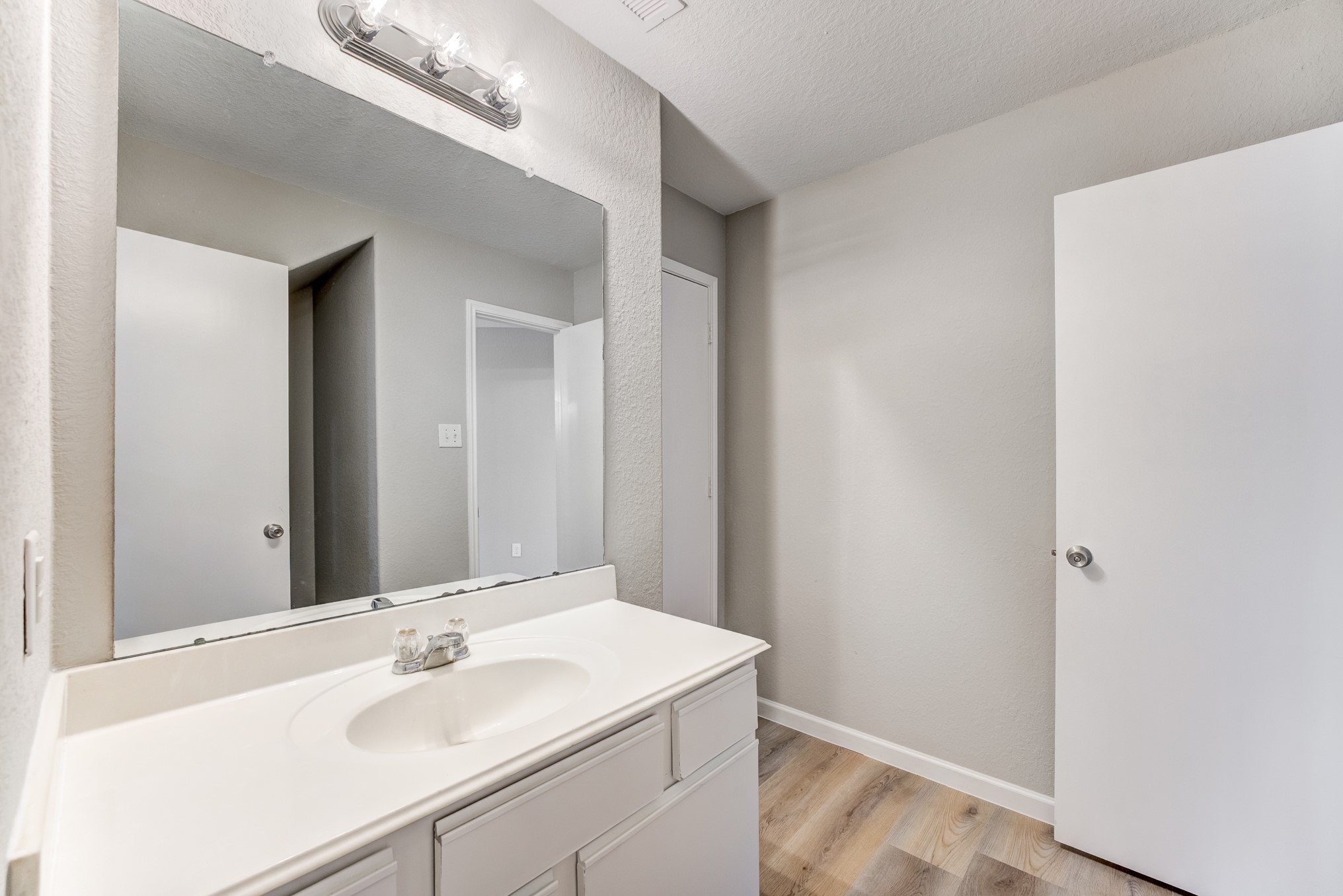 8038 Narrow Brook Way Houston, TX 77016 - Photo 24 of 50 a bathroom with a sink and a mirror