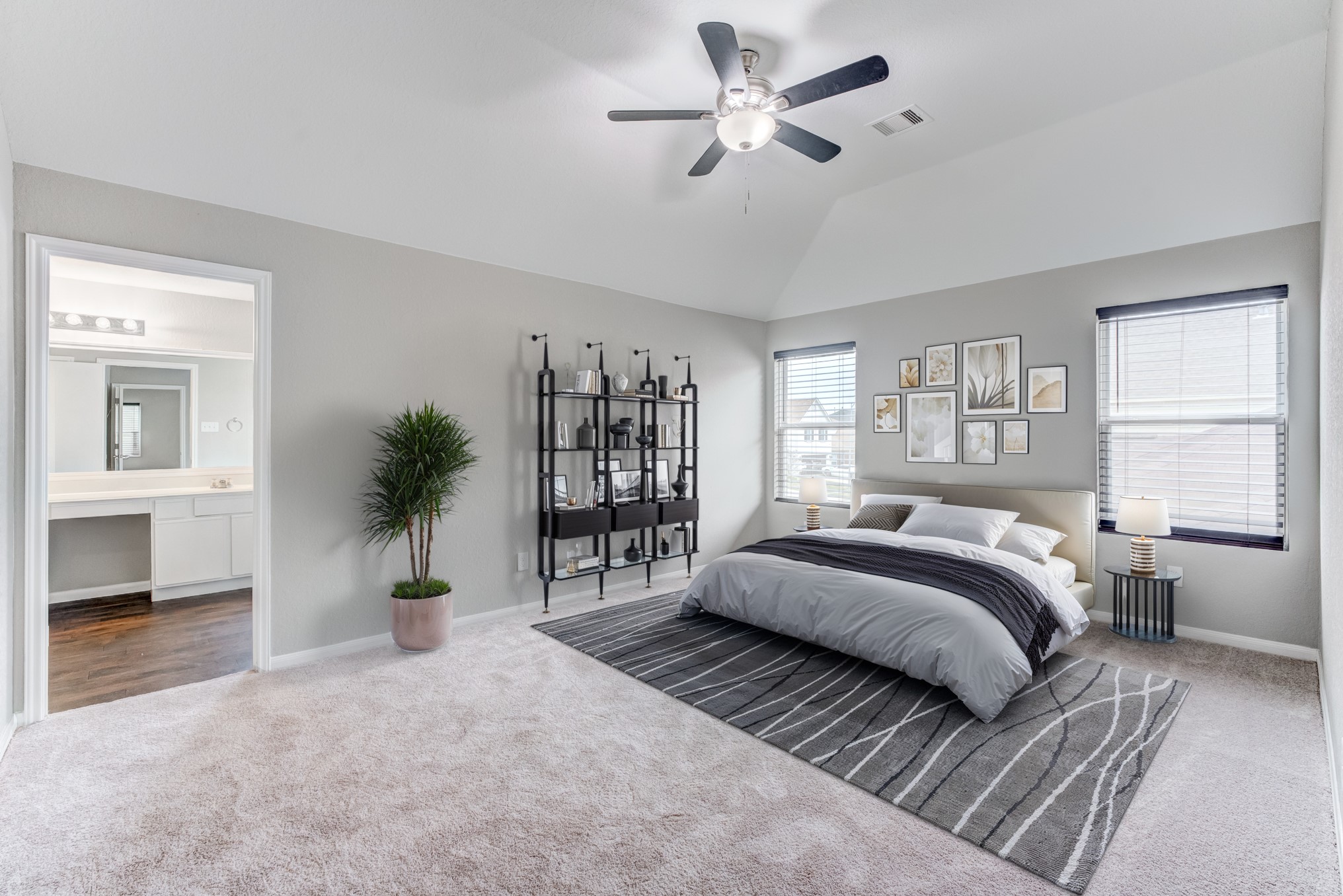 8038 Narrow Brook Way Houston, TX 77016 - Photo 33 of 50 a spacious bedroom with a large bed and a chandelier