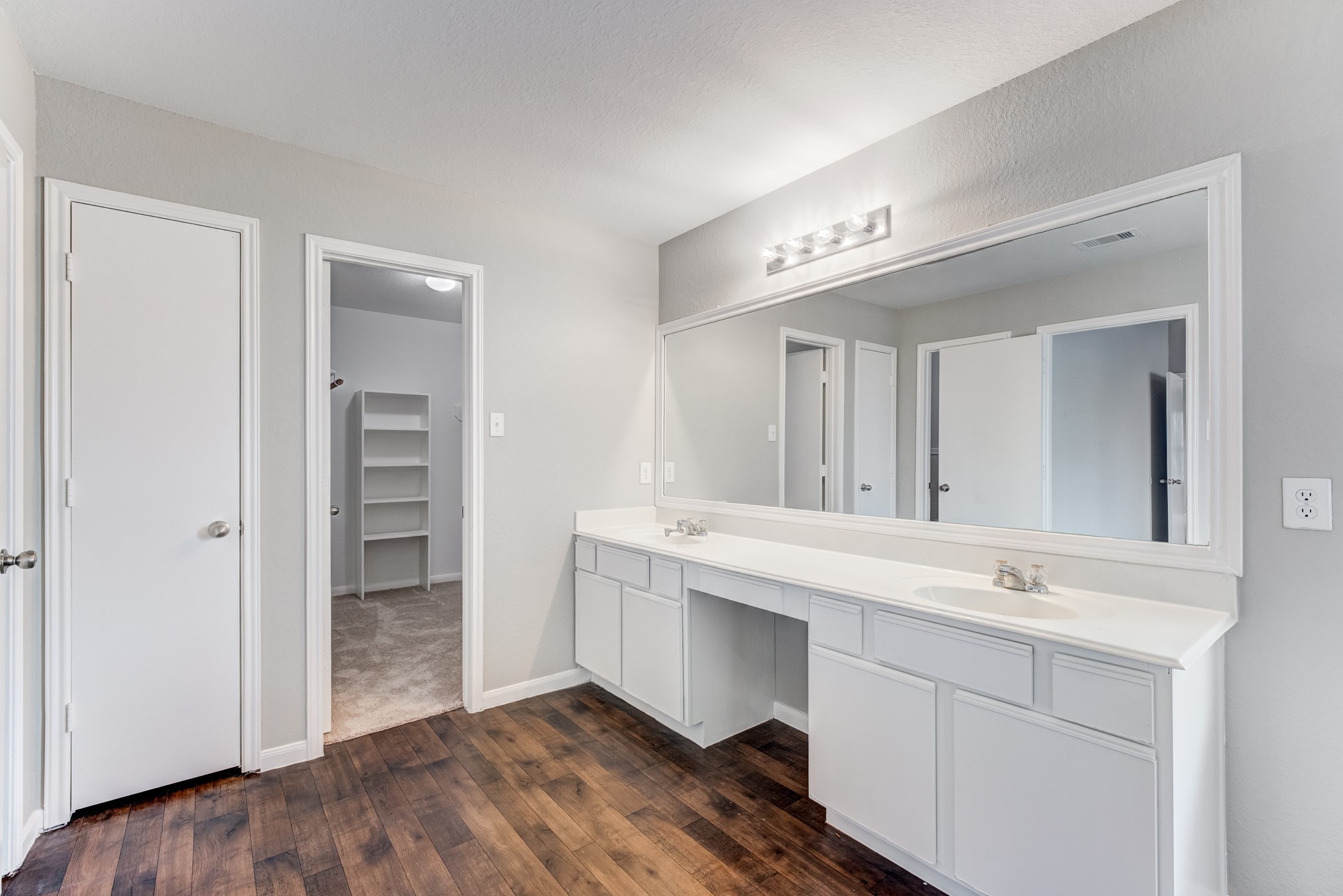 8038 Narrow Brook Way Houston, TX 77016 - Photo 37 of 50 a spacious bathroom with a sink and a mirror