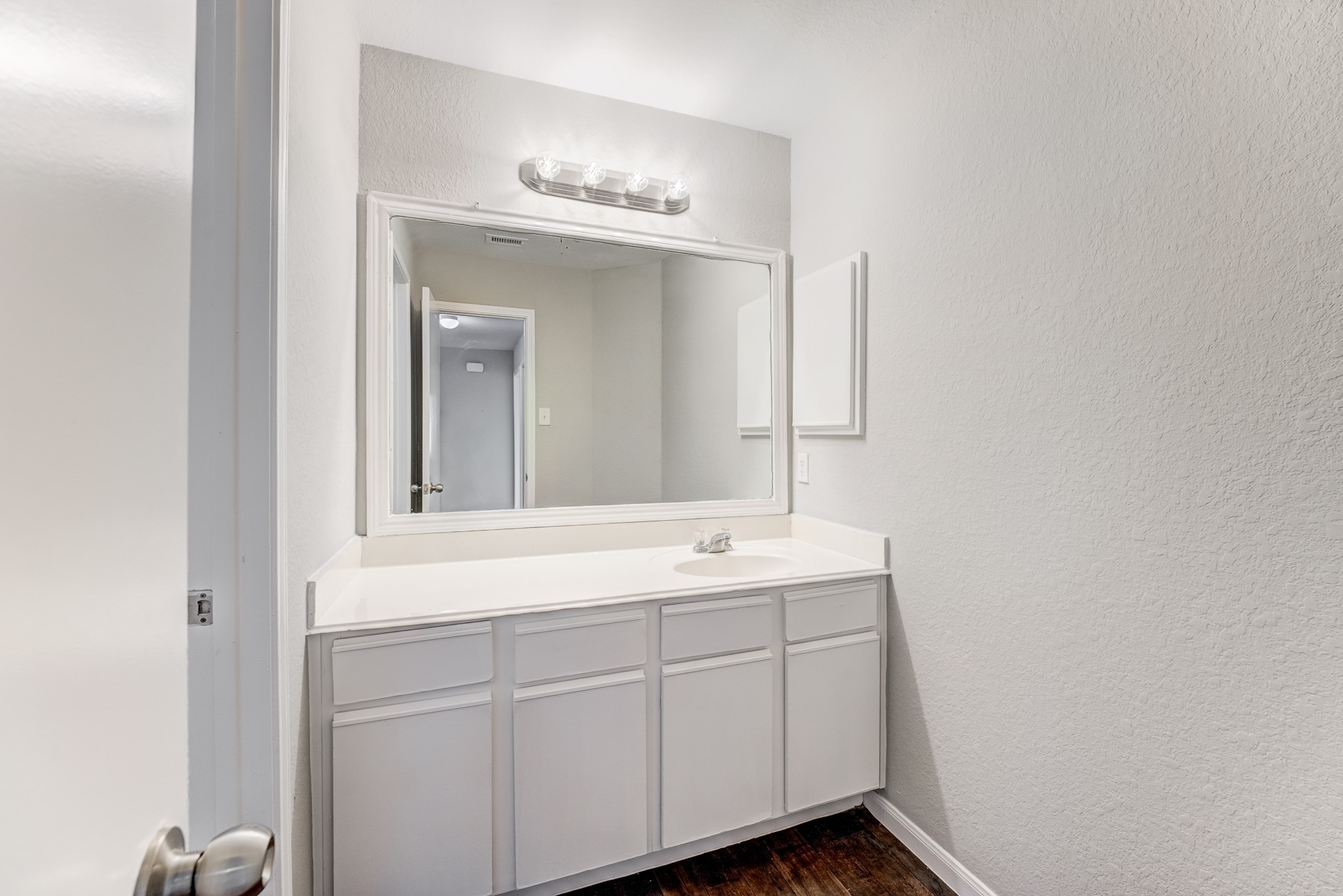 8038 Narrow Brook Way Houston, TX 77016 - Photo 44 of 50 a bathroom with a sink and a mirror