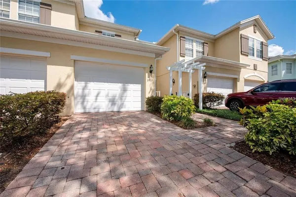 a view of a front of a house with a yard