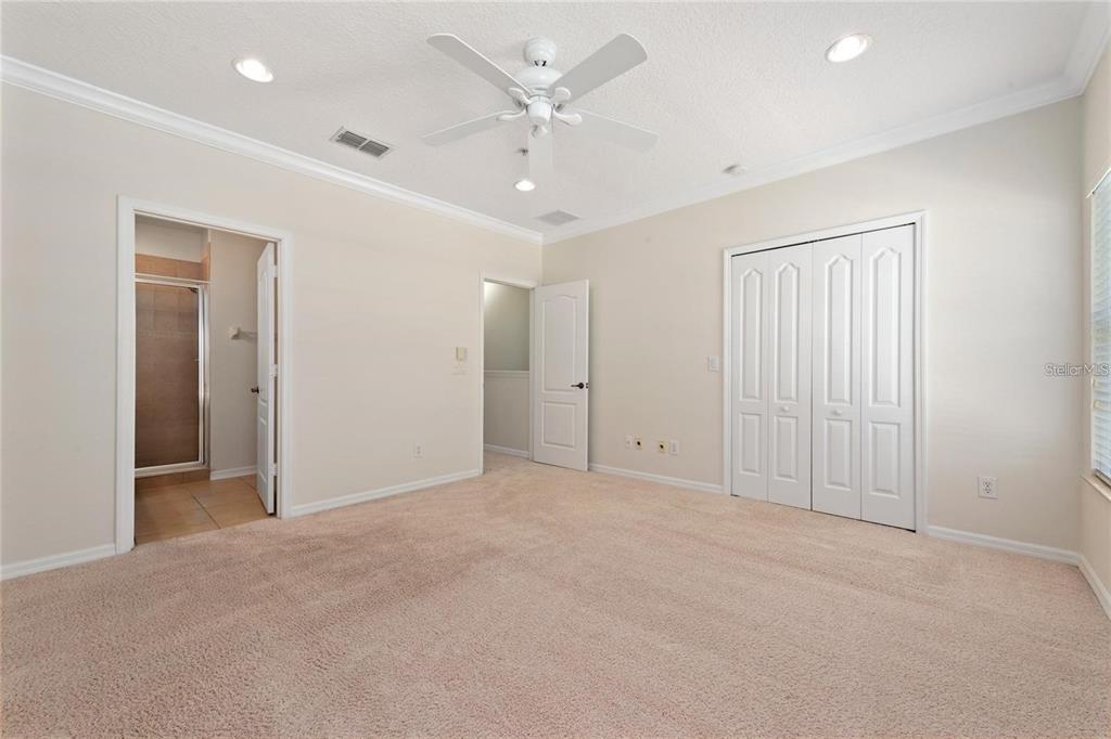 5957 Strada Capri Way Orlando, FL 32835 - Photo 11 of 20 an empty room with fan and a ceiling fan