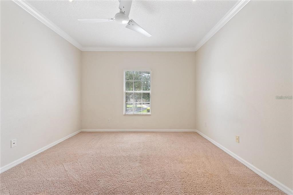 5957 Strada Capri Way Orlando, FL 32835 - Photo 17 of 20 an empty room with a window