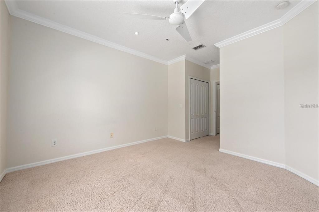 5957 Strada Capri Way Orlando, FL 32835 - Photo 18 of 20 an empty room with a empty space and a ceiling fan