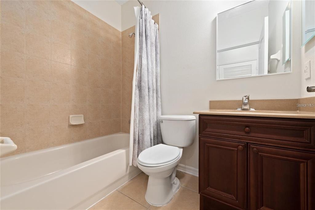 5957 Strada Capri Way Orlando, FL 32835 - Photo 19 of 20 a bathroom with a sink toilet and shower