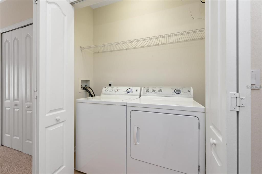 5957 Strada Capri Way Orlando, FL 32835 - Photo 20 of 20 a utility room with dryer and washer