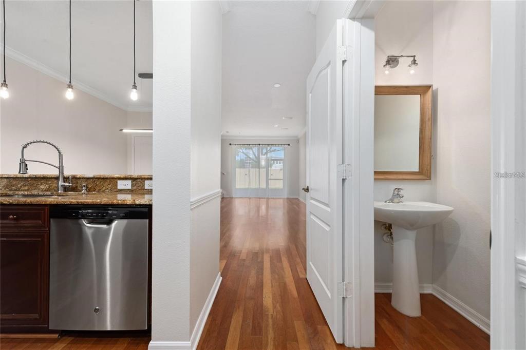 5957 Strada Capri Way Orlando, FL 32835 - Photo 3 of 20 a view of a hallway with wooden floor and staircase