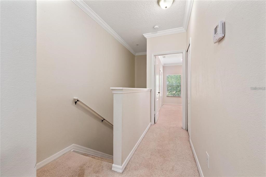 5957 Strada Capri Way Orlando, FL 32835 - Photo 9 of 20 a view of a hallway with closet