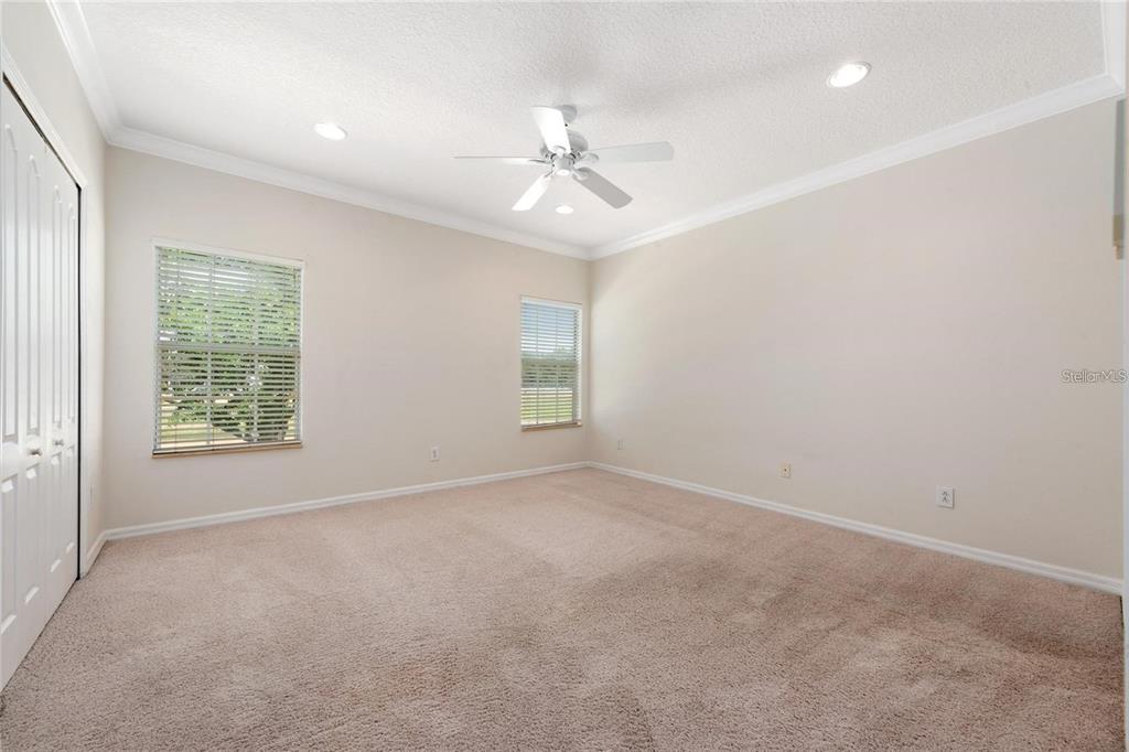 5957 Strada Capri Way Orlando, FL 32835 - Photo 10 of 20 wooden floor in an empty room with a window