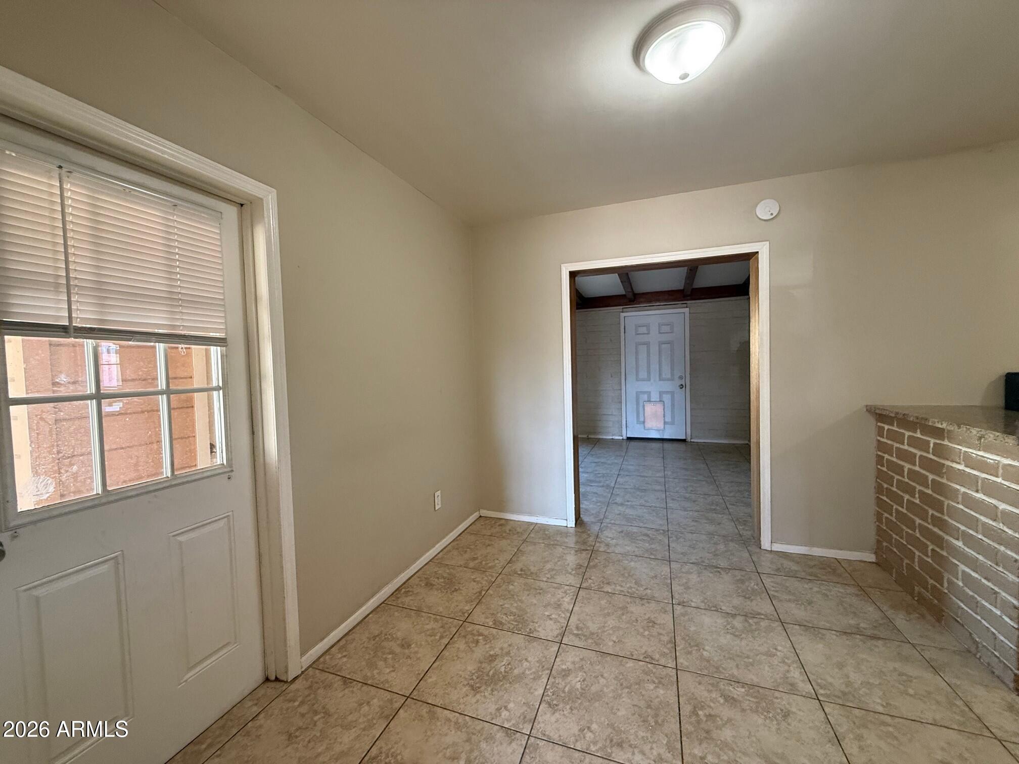 4447 East Almeria Road Phoenix, AZ 85008 - Photo 3 of 9 a view of an empty room and window