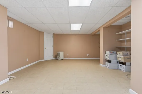 a view of an empty room and fire place