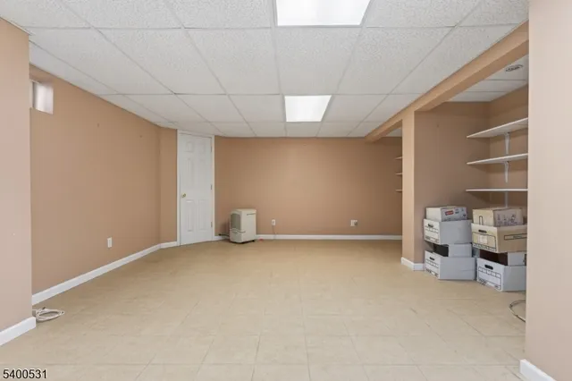 a view of an empty room and fire place