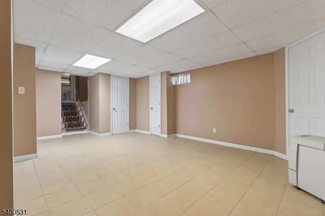 a bathroom with a granite countertop sink a toilet and a mirror
