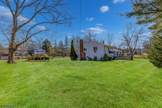 a view of a house with backyard